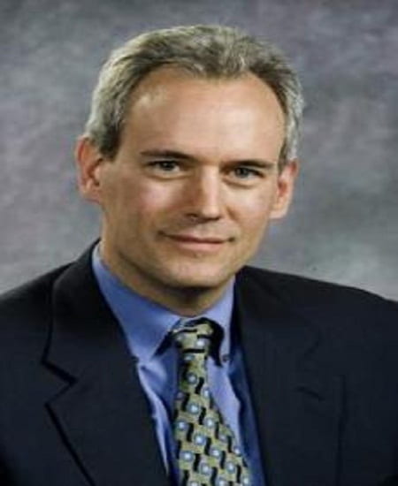 headshot of Steven Vogel in professional attire with grey background
