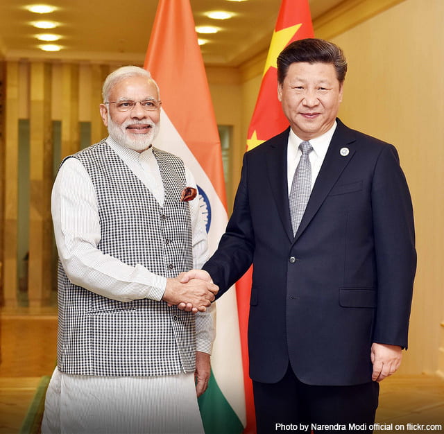 Prime Minister Modi shaking hands with President Xi Jinping
