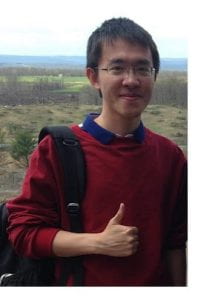 Zhongtian Han wearing a red shirt with a thumbs up