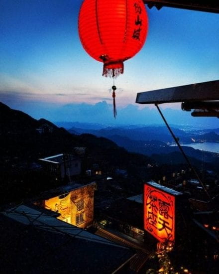The town of Jiufen rests on the side of a mountain range, overlooking the ocean and the larger city of Keelung.