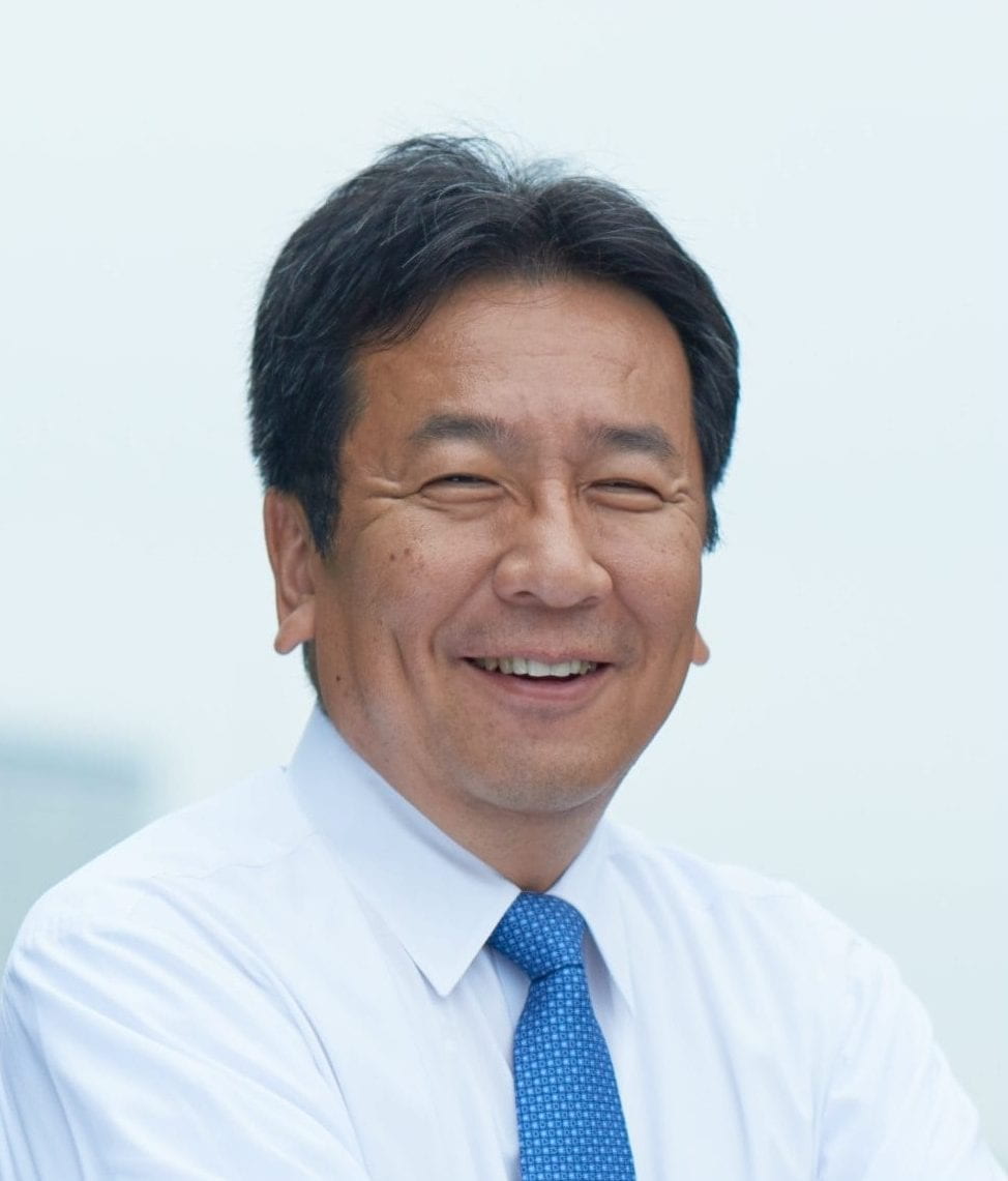 Headshot of Yukio Edano in white shirt