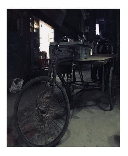 old rickshaw pull cart in a shed/storage room
