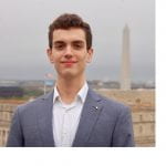 headshot of Zachary Haver with the Washington Monument in the background