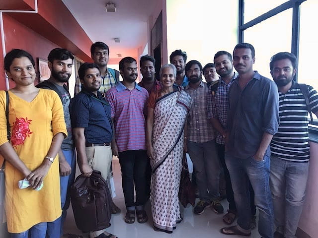 Deepa Ollapally taking a group photo with students from Pondicherry University