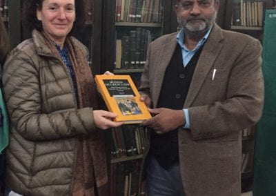 Mike Natif and Abu Sad Islahi holding a book posing for photo
