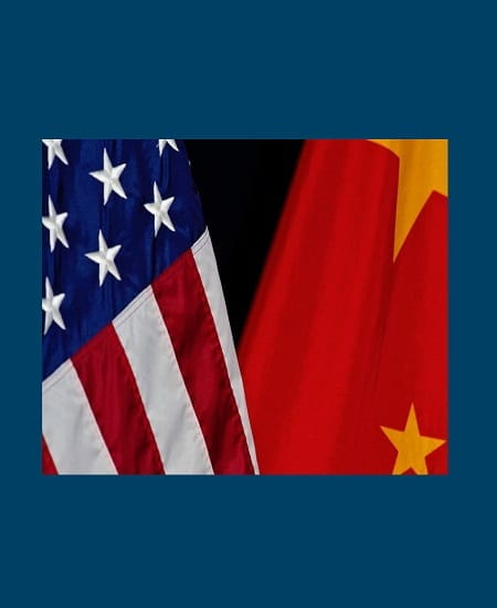 The flags of China and the United States stand displayed next to each other