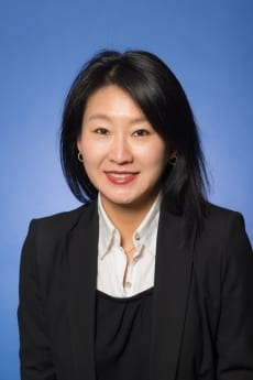 Headshot of Professor Jisoo Kim in professional attire