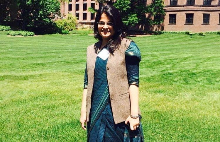 photo of mariya salim standing in a grassy area