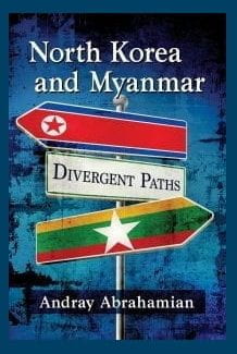 blue book cover with Burmese and North Korean flags in the shape of road signs; text: North Korea and Myanmar: Divergent Paths by Andray Abrahamian