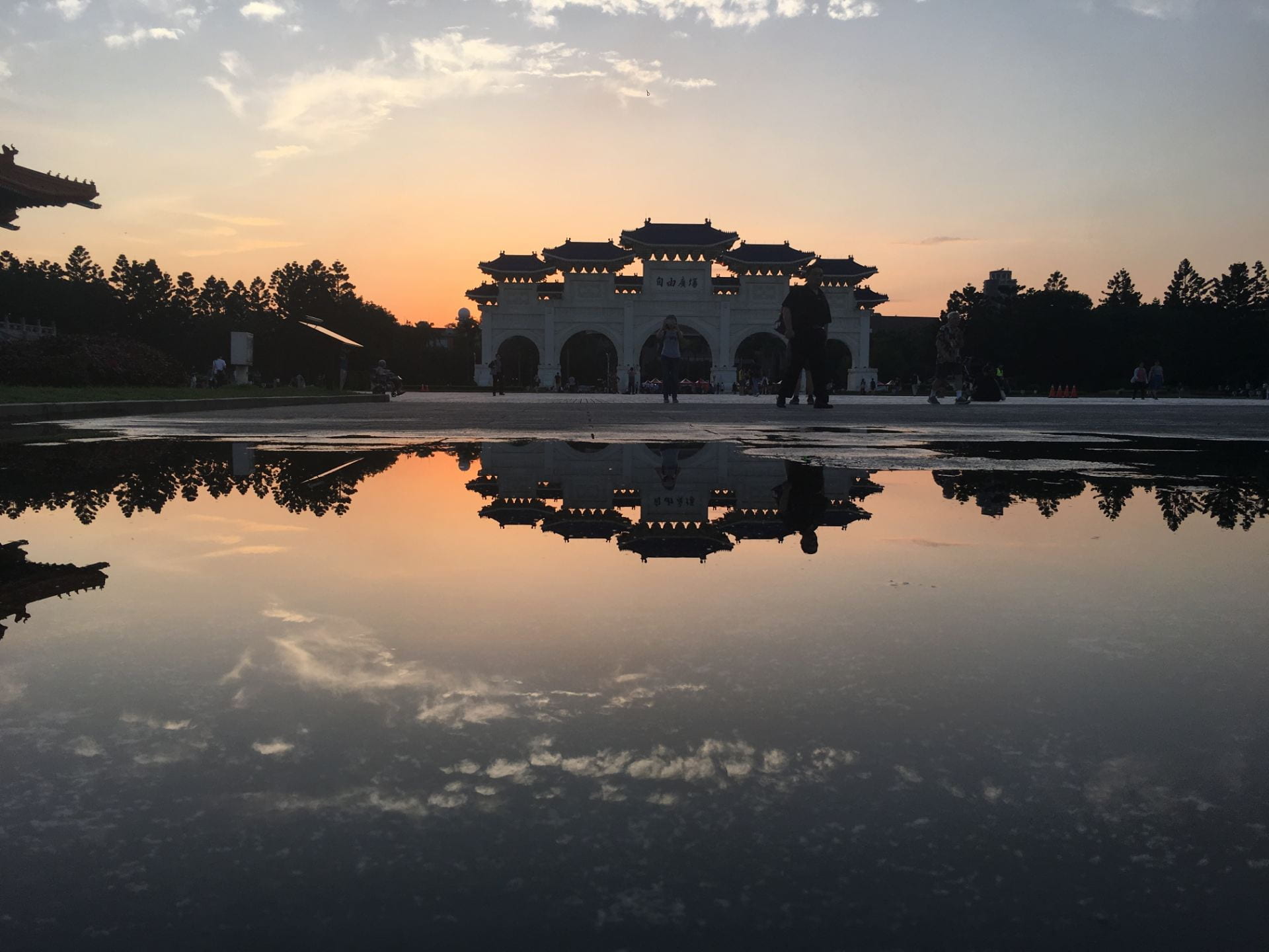 Chiang kai-Shek Memorial Hall at sunset with reflection in a large puddle of water