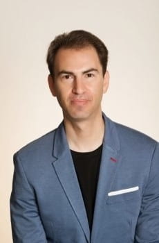 Gregg Brazinsky, in professional attire against a white background