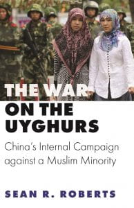 Two Uyghur women on a street with book title underneath