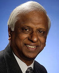 headshot of Muthiah Alagappa with blue background