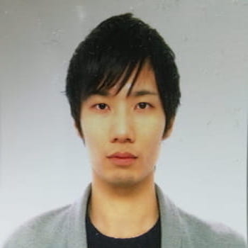 headshot of Toshihide Takayanagi with white background 