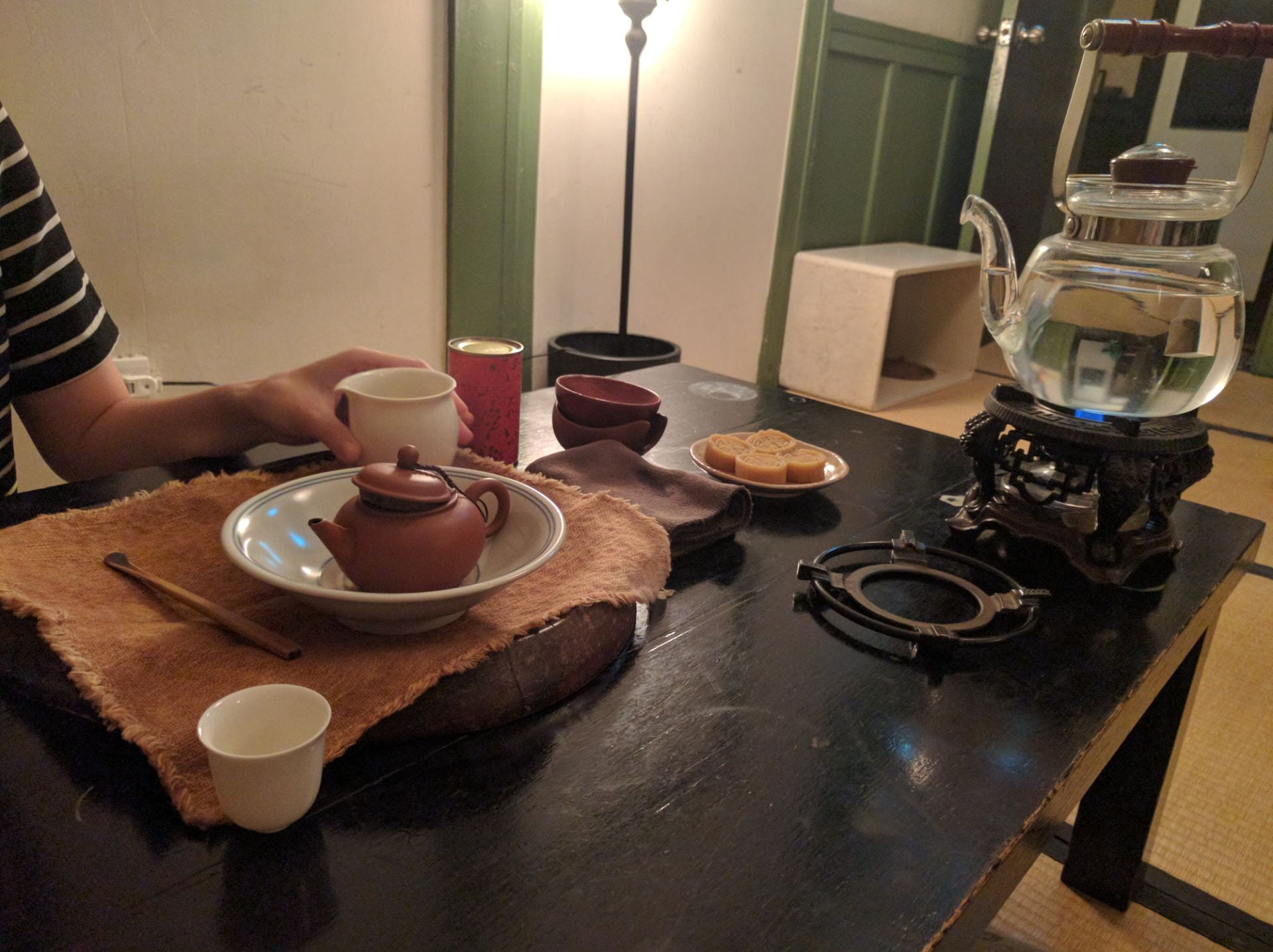 table with Chinese tea set and tea snacks