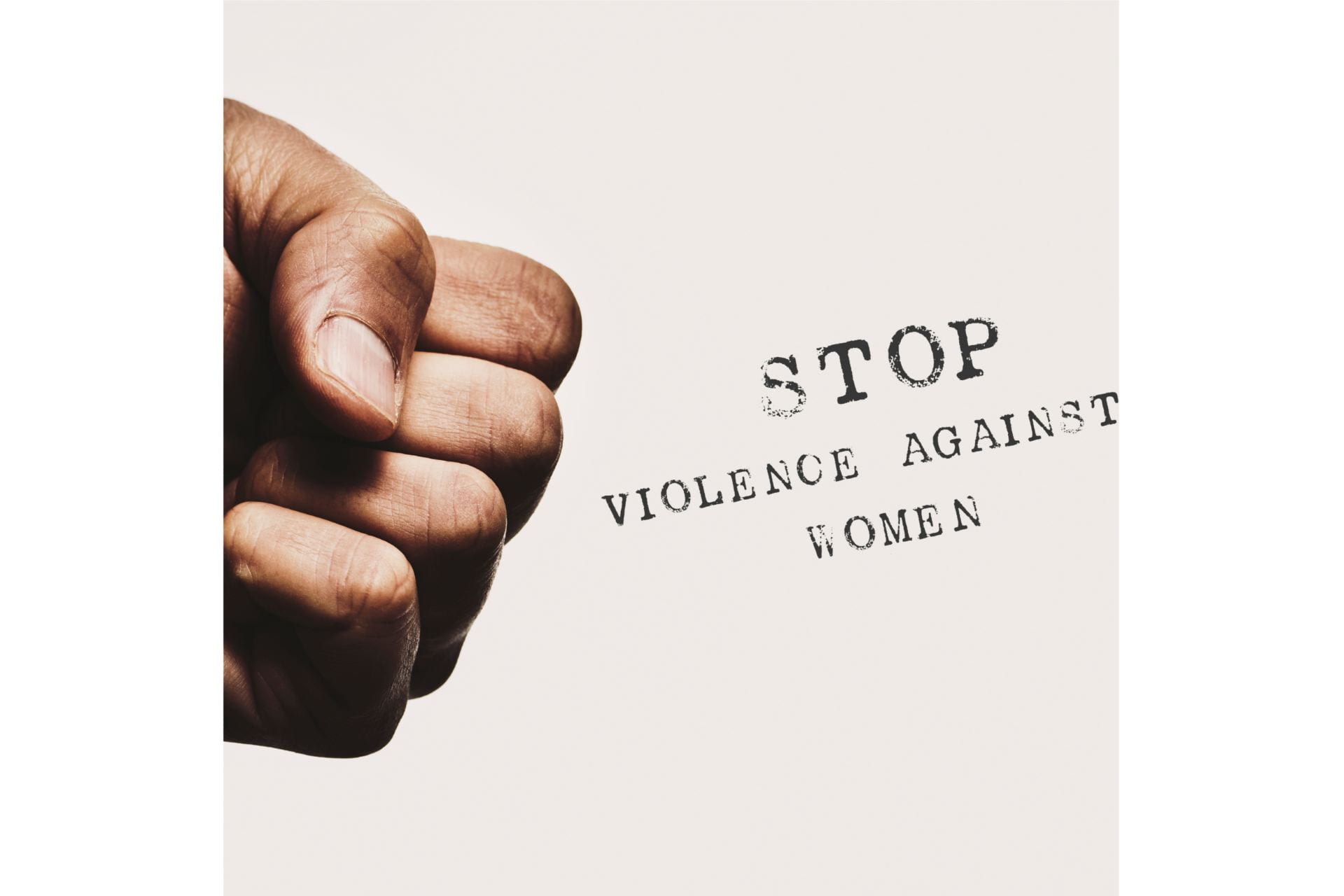 poster with image of a closed fist; text: Stop Violence Against Women