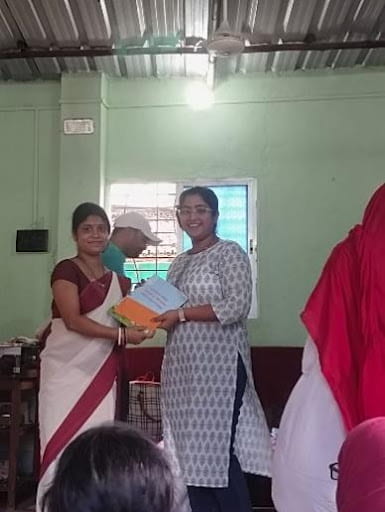 A woman receiving a certificate